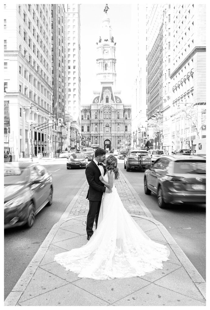 Couple kissing on Broad st in front of Philadelphia City Hall