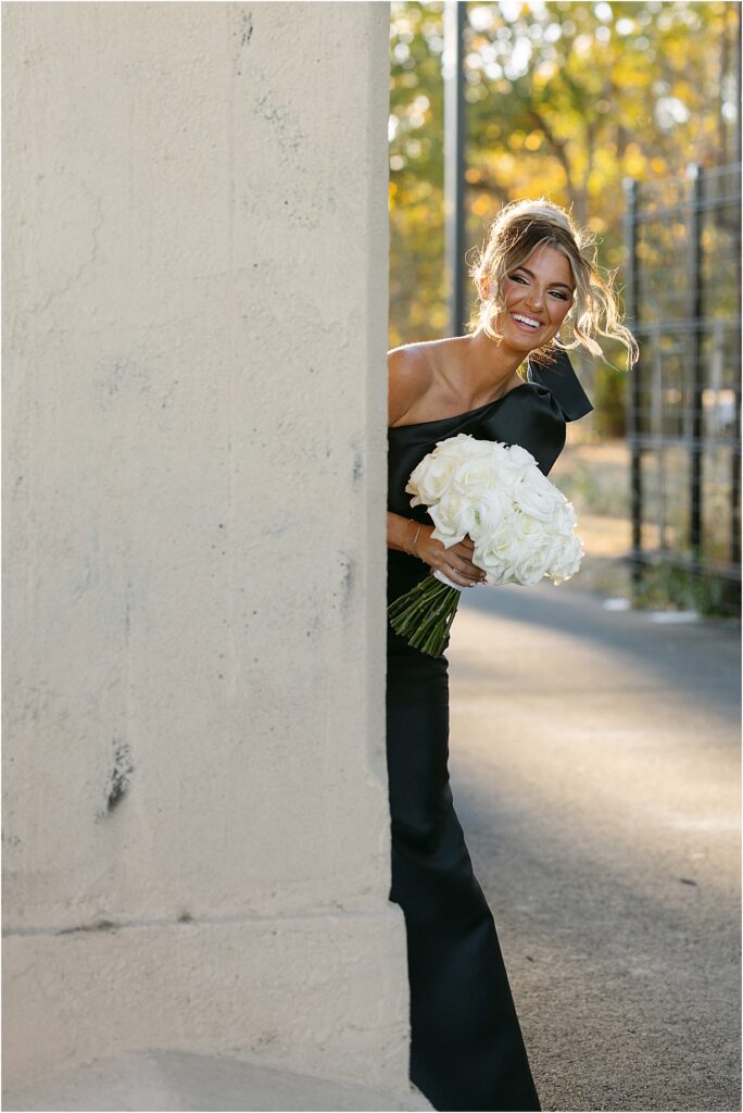 Bridesmaid sneaking peek at couples portraits at Switch House in Philadelphia