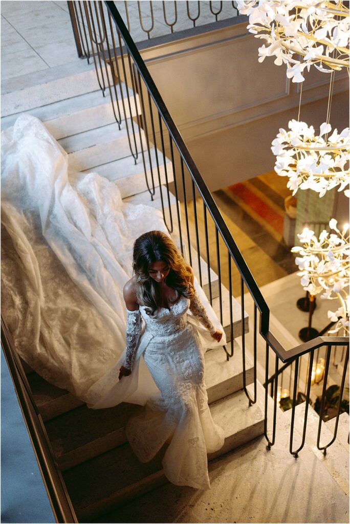 editorial bridal portrait of bride walking down stairs at Switch House