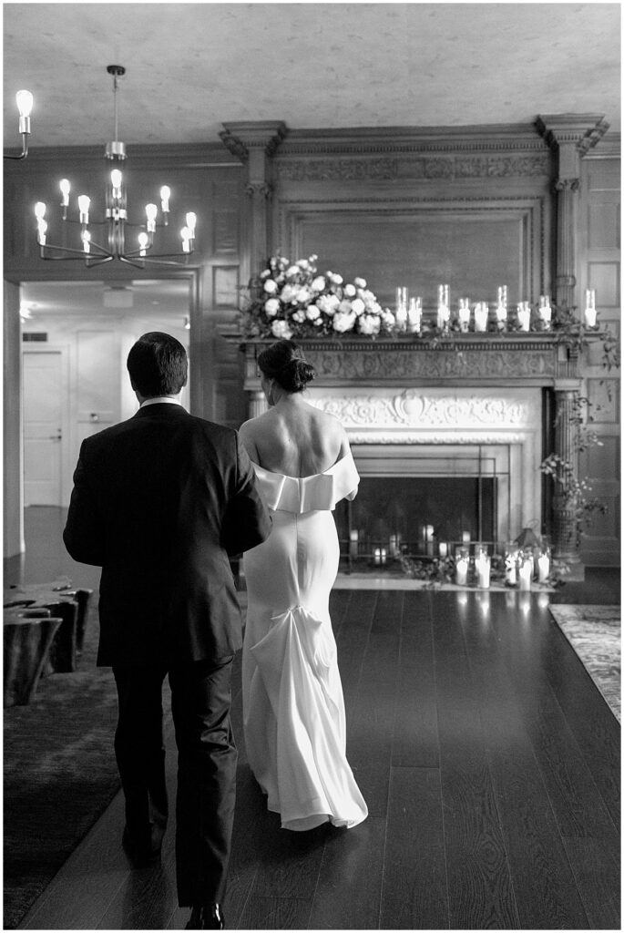 Couple walking through the Green Room at New Jersey wedding venue Pendry Natirar