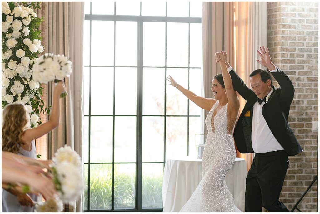 Couple entering reception at New Jersey wedding at Natirar